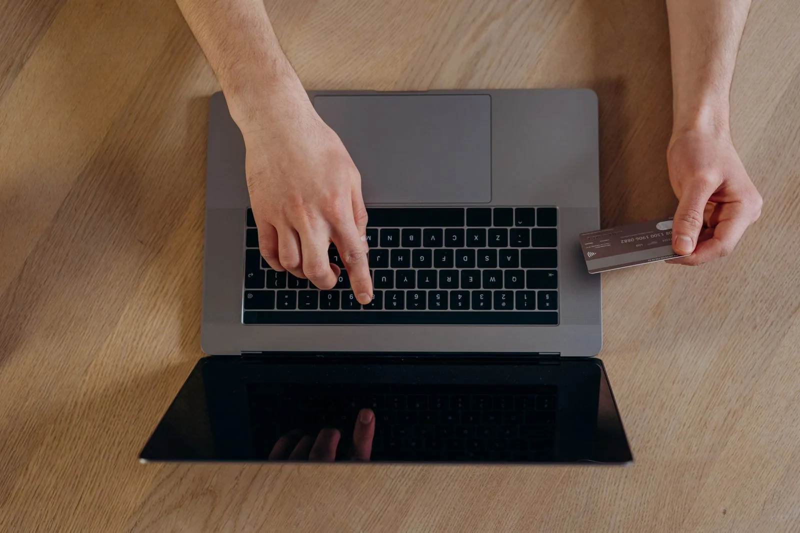 Person opening a bank account on a laptop